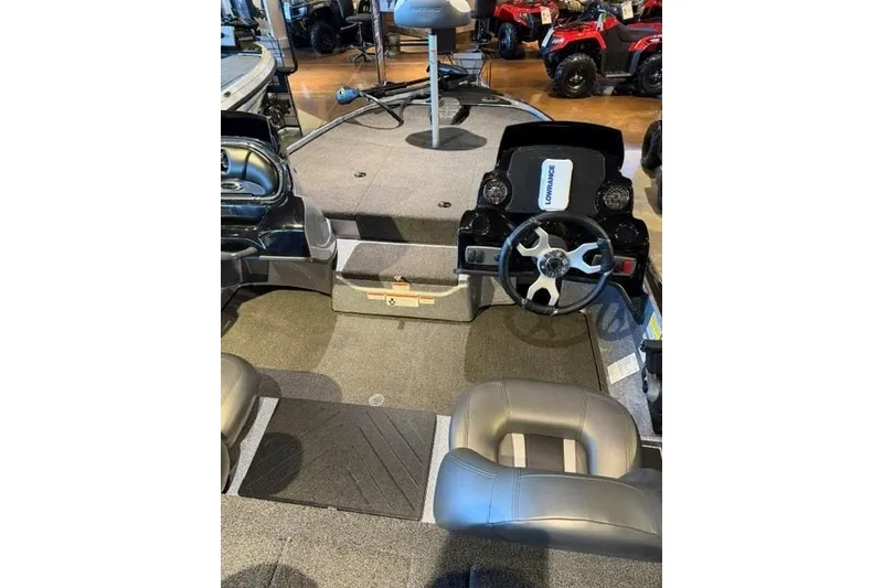 Slide: The Image of Interior of a 2026 Nitro Z17 boat featuring steering console and seating. - 11