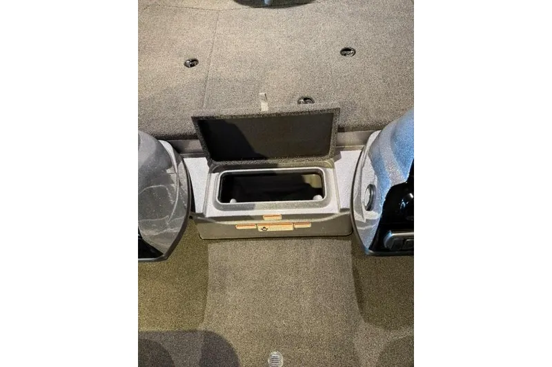 Slide: The Image of Open storage compartment in 2026 Nitro Z17 boat interior. - 10
