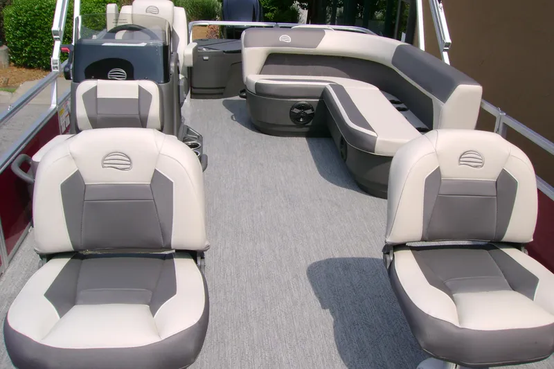 Slide: The Image of 2026 Sun Tracker Bass Buggy 18 DLX pontoon boat interior with cushioned seating. - 7