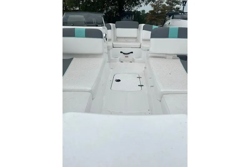 Slide: The Image of 2026 Tahoe T16 boat interior with white seating and teal accents. - 8