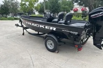 Slide: The Image of 2026 Tracker Super Guide V-16 SC boat on trailer, parked outdoors. - 50