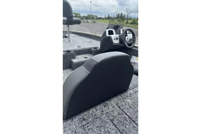 Slide: The Image of 2026 Tracker Pro Team 175 boat interior with steering wheel and seating. - 3