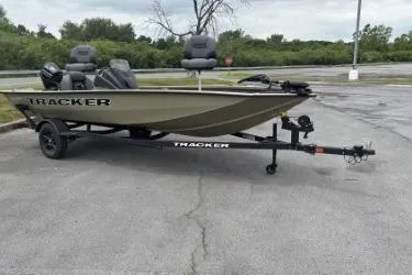 The Image of 2026 Tracker Pro Team 175 boat on trailer in parking lot. - 0