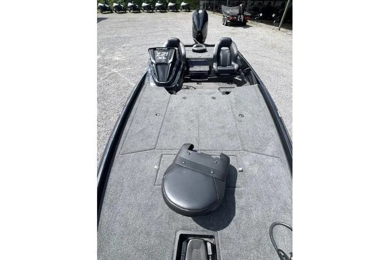 Slide: The Image of 2026 Nitro Z21 XL Pro boat interior with seating and carpeted deck. - 102
