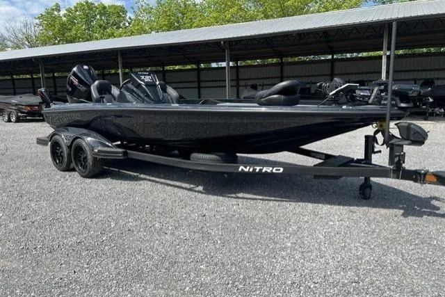 Slide: The Image of 2026 Nitro Z21 XL Pro boat on trailer in outdoor storage area. - 109