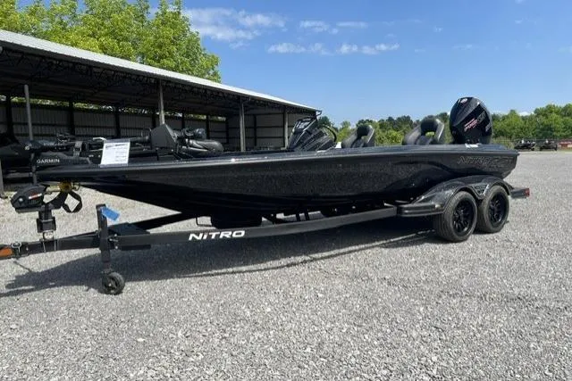 Slide: The Image of 2026 Nitro Z21 XL Pro boat on trailer in outdoor setting. - 111