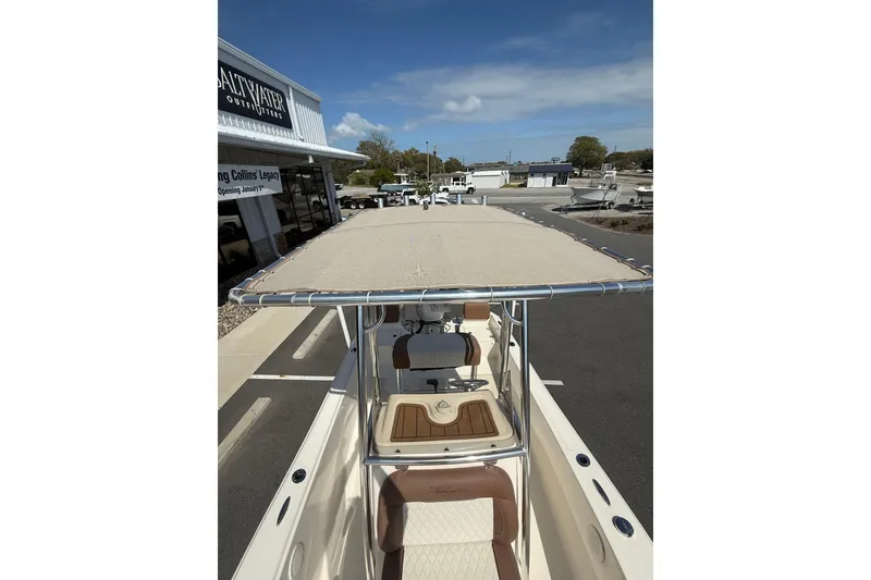 Slide: The Image of 2022 Pioneer 180 Sportfish boat with canopy at Saltwater Outfitters dealership. - 3