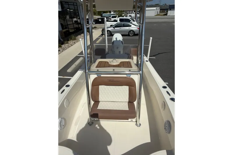 Slide: The Image of 2022 Pioneer 180 Sportfish boat interior with brown and white seating. - 4