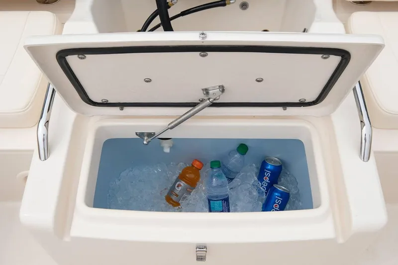 Slide: The Image of Manufacturer Provided Image: Built-in cooler with drinks on a 2019 Grady-White Freedom 215 boat. - 23