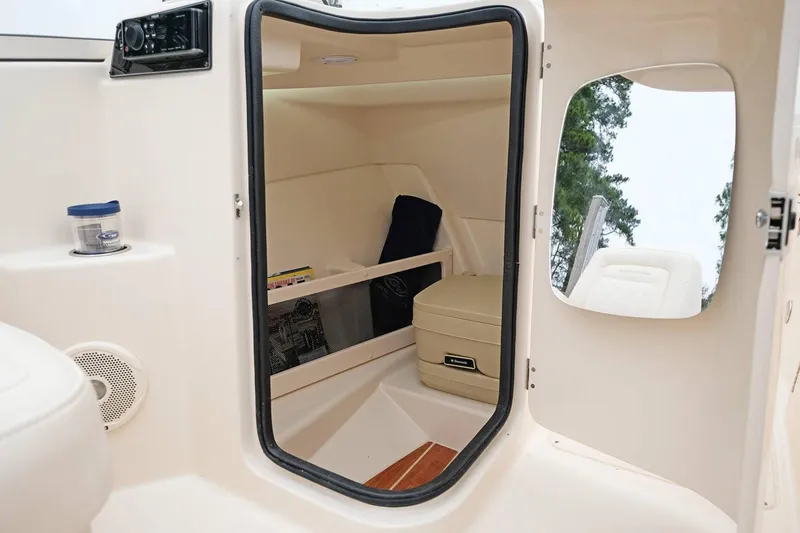 Slide: The Image of Manufacturer Provided Image: 2019 Grady-White Freedom 215 cabin interior with storage compartments and seating. - 26