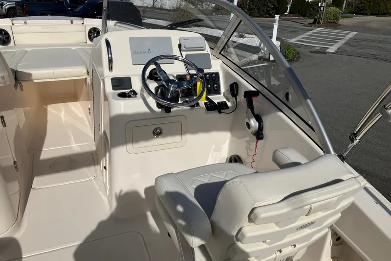 Slide: The Image of 2019 Grady-White Freedom 215 boat interior with steering wheel and control panel. - 3