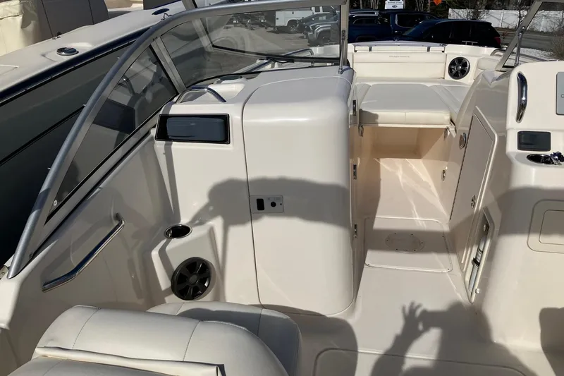 Slide: The Image of 2019 Grady-White Freedom 215 boat interior, featuring seating and control panel. - 4