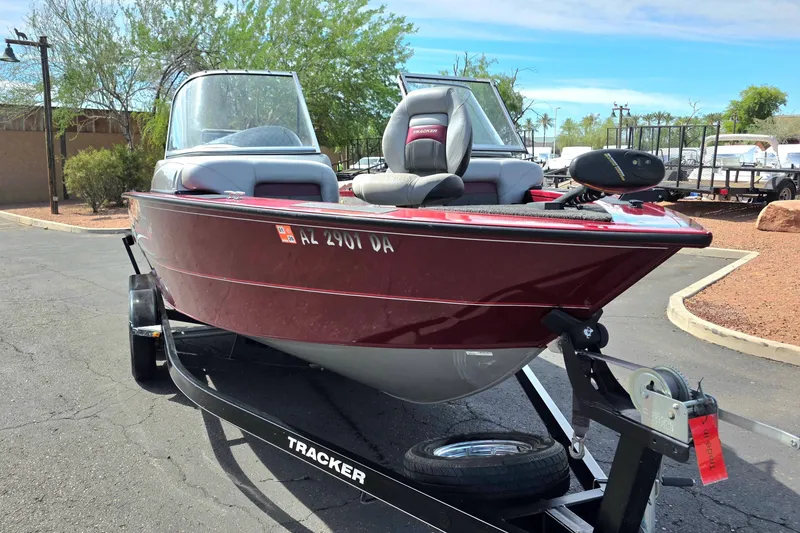 Slide: The Image of 2015 Tracker Targa V-18 Combo boat on trailer, parked outdoors. - 2