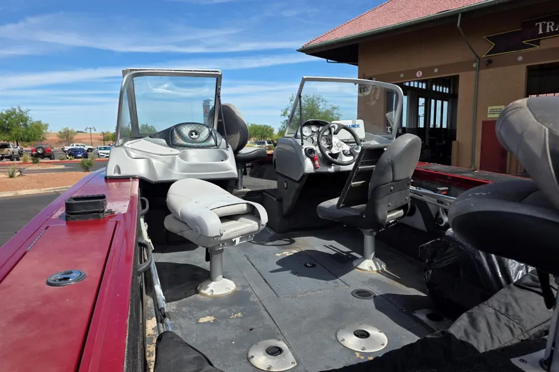 Slide: The Image of 2015 Tracker Targa V-18 Combo boat interior with seating and steering wheel. - 3