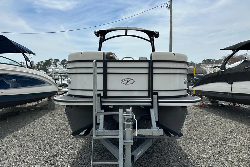 Slide: The Image of 2024 Veranda VP25RCT pontoon boat on trailer, displayed outdoors at a marina. - 4