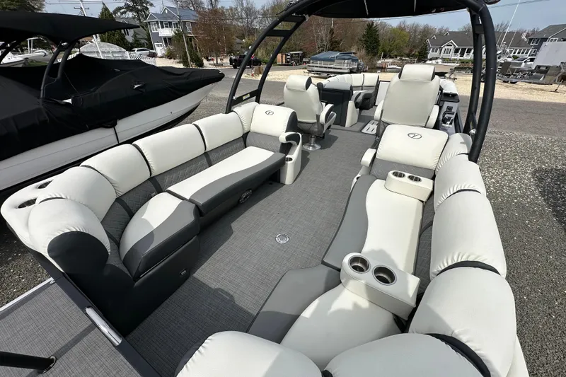 Slide: The Image of 2024 Veranda VP25RCT pontoon boat interior with luxurious seating and cup holders. - 6