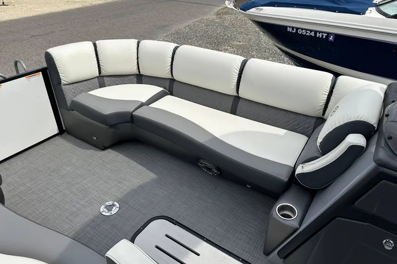 Slide: The Image of Luxurious seating on 2024 Veranda VP25RCT pontoon boat with gray and white upholstery. - 9