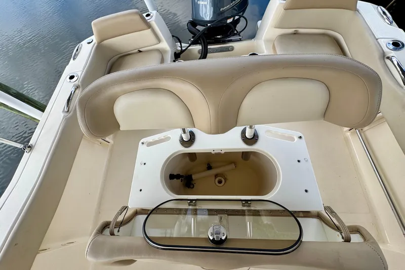 Slide: The Image of 2024 Scout 195 Sportfish boat interior with seating and storage compartment. - 23