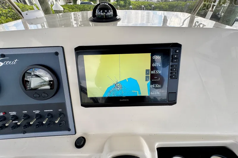 Slide: The Image of 2024 Scout 195 Sportfish dashboard with Garmin navigation and Yamaha speed gauge. - 27