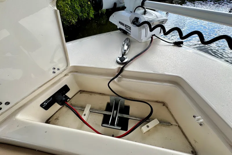 Slide: The Image of 2024 Scout 195 Sportfish boat anchor compartment with Minn Kota Terrova trolling motor. - 37