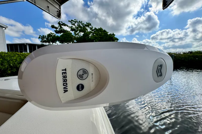 Slide: The Image of 2024 Scout 195 Sportfish boat with Terrova trolling motor, sunny day, water view. - 39