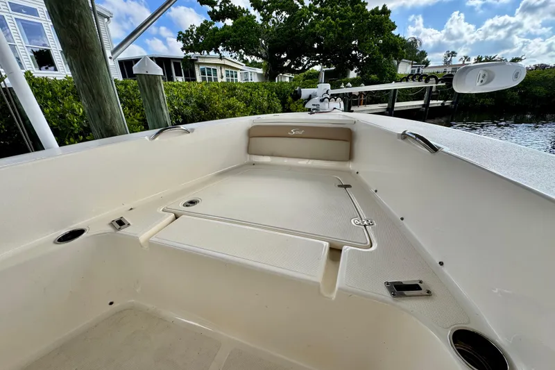 Slide: The Image of 2024 Scout 195 Sportfish boat interior with storage compartments and sleek design. - 40
