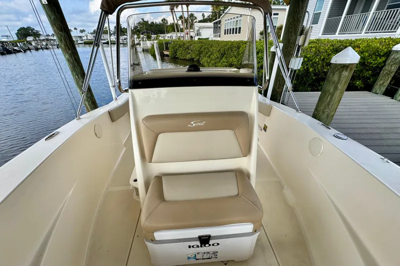 Slide: The Image of 2024 Scout 195 Sportfish boat interior with seating and Igloo cooler. - 42