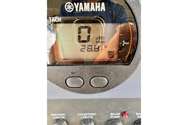 Slide: The Image of Yamaha tachometer display on 2024 Scout 195 Sportfish boat dashboard. - 49