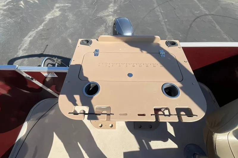 Slide: The Image of Fishing station on 2021 Sylvan Mirage Fish 820 Party Fish boat, featuring cup holders and measuring guide. - 11