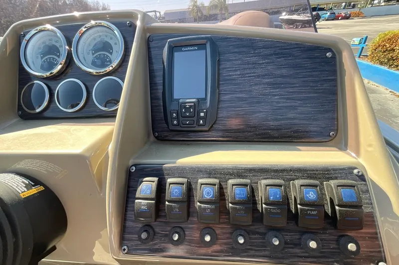 Slide: The Image of Dashboard of 2021 Sylvan Mirage Fish 820 Party Fish with gauges and controls. - 16