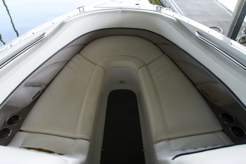 Slide: The Image of Interior view of a 2005 Cobalt 262 boat with white seating. - 12
