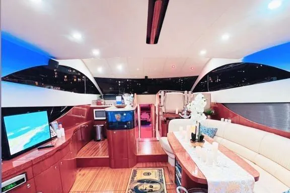 Slide: The Image of Luxurious interior of a 2006 Fairline 50 yacht with modern amenities and elegant design. - 14