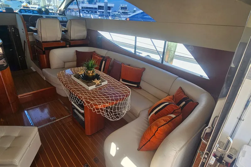 Slide: The Image of Luxurious 2006 Fairline 50 yacht interior with elegant seating and decorative pillows. - 15