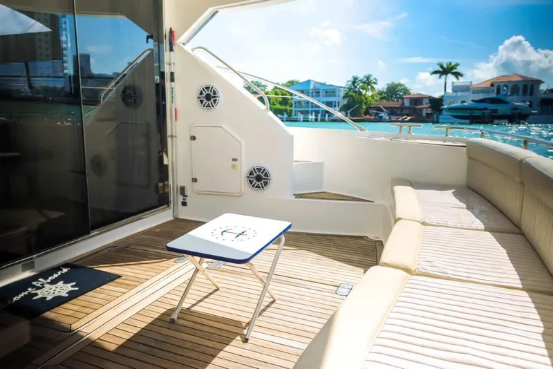 Slide: The Image of Luxury 2006 Fairline 50 yacht deck with seating, table, and scenic waterfront view. - 9