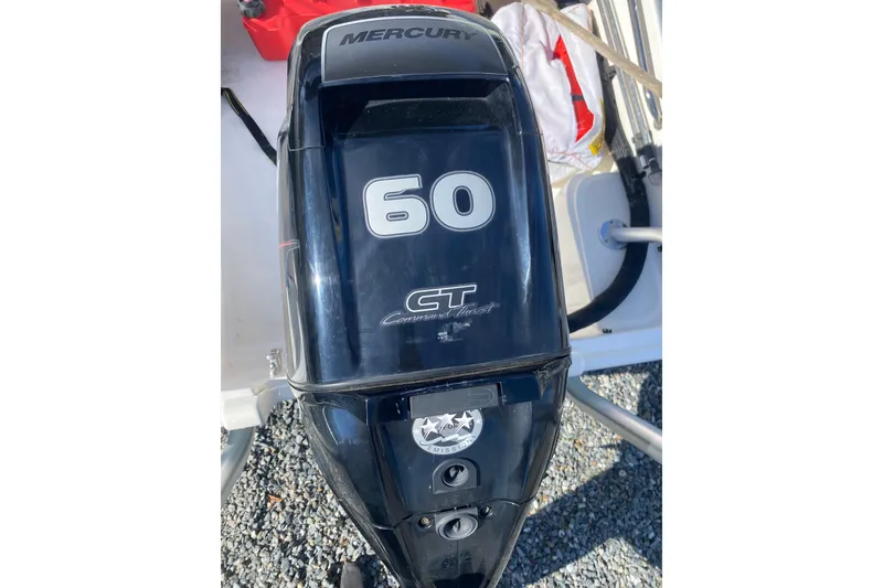 Slide: The Image of Mercury 60 HP outboard motor on a 2018 Boston Whaler 150 Super Sport boat. - 8