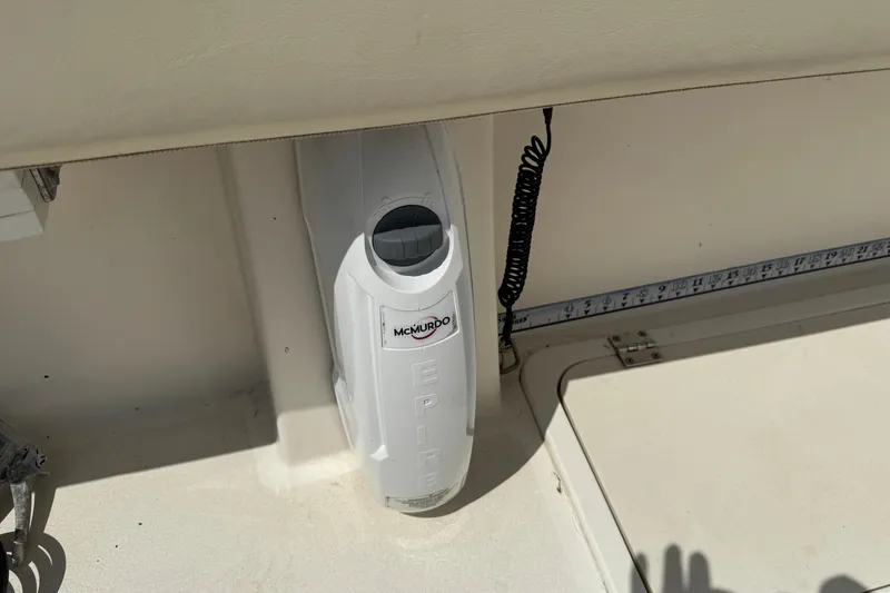 Slide: The Image of McMurdo EPIRB device on 2016 Defiance Admiral 270 EX boat deck. - 11