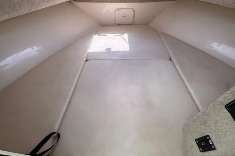 Slide: The Image of Interior cabin of 2016 Defiance Admiral 270 EX boat, featuring spacious seating and storage. - 17