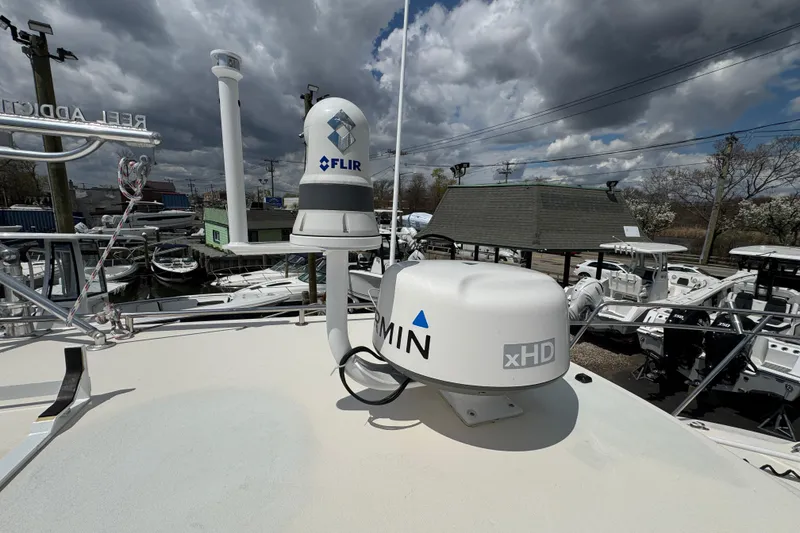 Slide: The Image of 2016 Defiance Admiral 270 EX boat with radar and FLIR system under cloudy sky. - 27