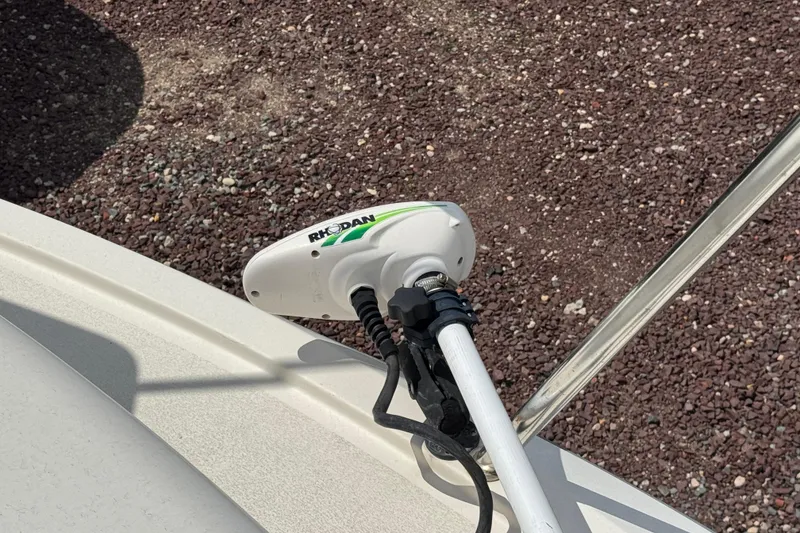 Slide: The Image of Rhoden trolling motor on 2016 Defiance Admiral 270 EX boat, parked on gravel. - 30