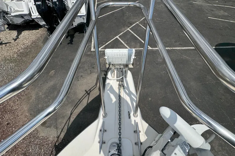 Slide: The Image of Bow view of 2016 Defiance Admiral 270 EX boat with anchor and railing. - 32