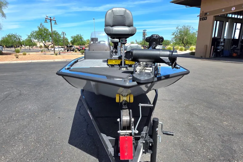 Slide: The Image of 2023 Tracker Bass Tracker Classic XL boat on trailer in outdoor setting. - 2