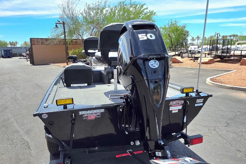 Slide: The Image of 2023 Tracker Bass Tracker Classic XL boat with Mercury 50 engine, parked outdoors. - 3
