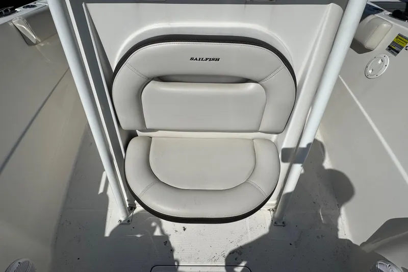 Slide: The Image of Sailfish 242 CC 2022 boat seat, white cushioned, compact design, marine-grade upholstery. - 20
