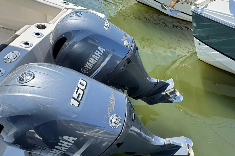 Slide: The Image of Twin Yamaha 150 outboard motors on a 2022 Sailfish 242 CC boat. - 3