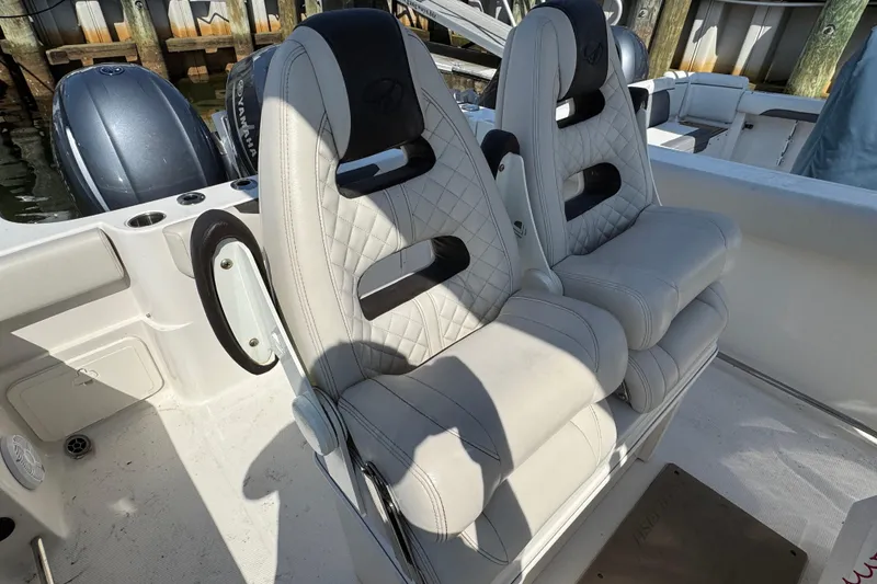 Slide: The Image of Luxury seating on 2022 Sailfish 242 CC boat with dual Yamaha engines. - 8