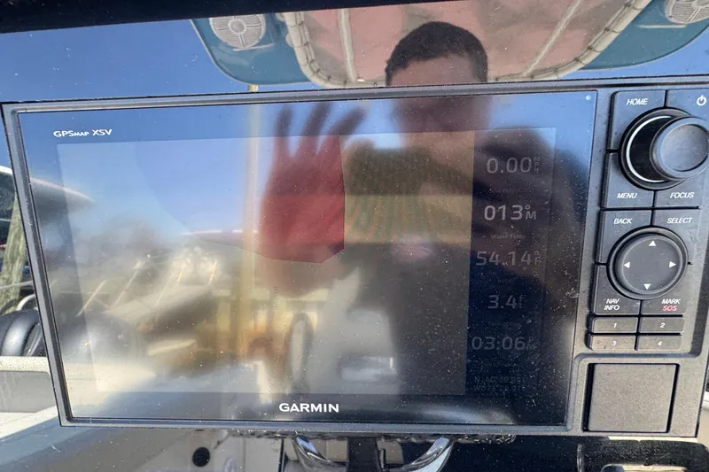 Slide: The Image of Garmin GPS display on 2022 Sailfish 242 CC boat dashboard. - 9