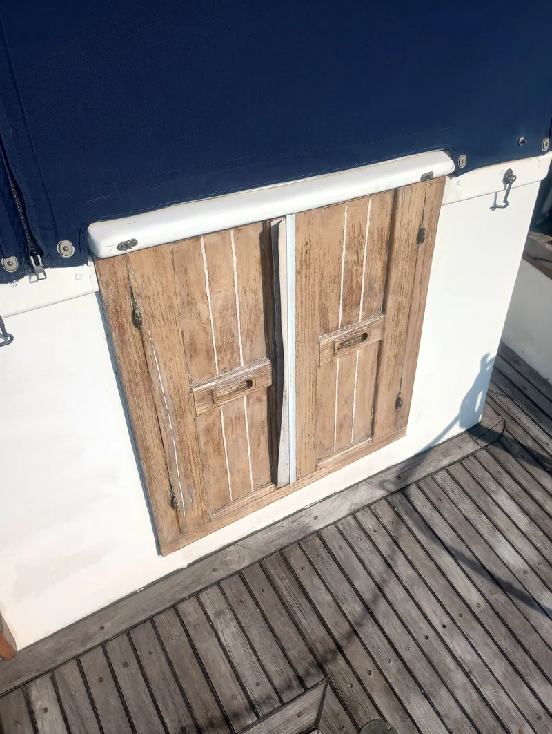 Slide: The Image of Wooden doors on a 1981 Marine Trading 44 Double Cabin boat. - 10