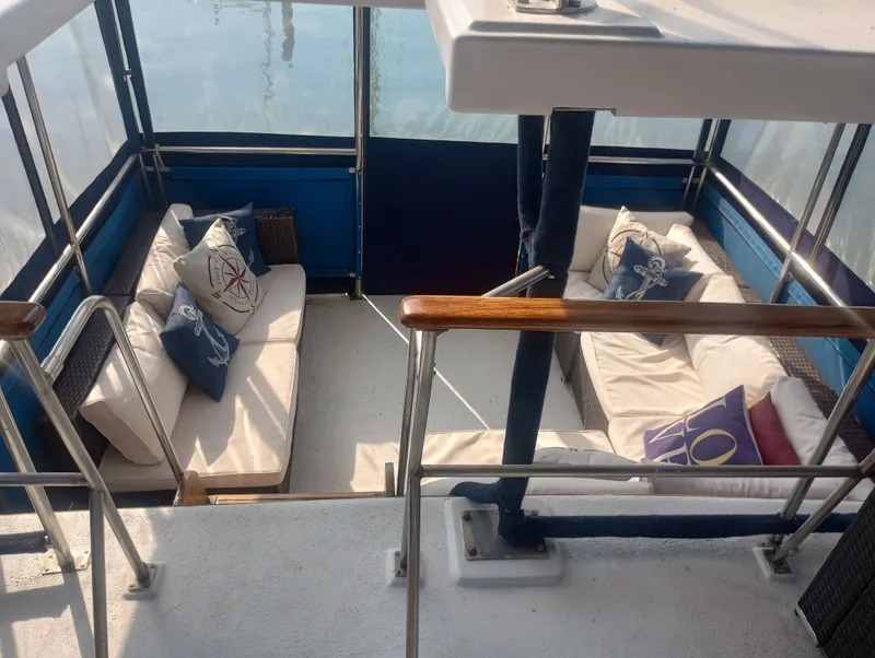 Slide: The Image of Marine Trading 44 Double Cabin 1981 with cozy seating area. - 20