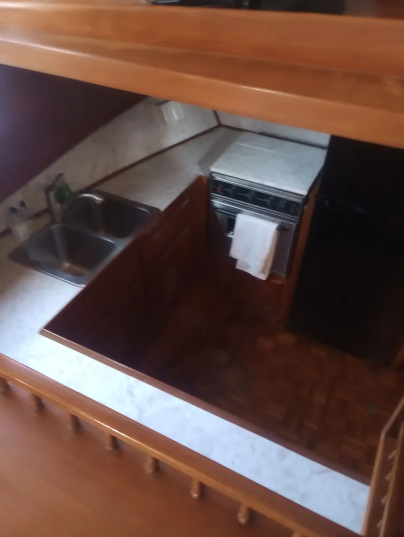 Slide: The Image of 1981 Marine Trading 44 Double Cabin yacht kitchen. - 28