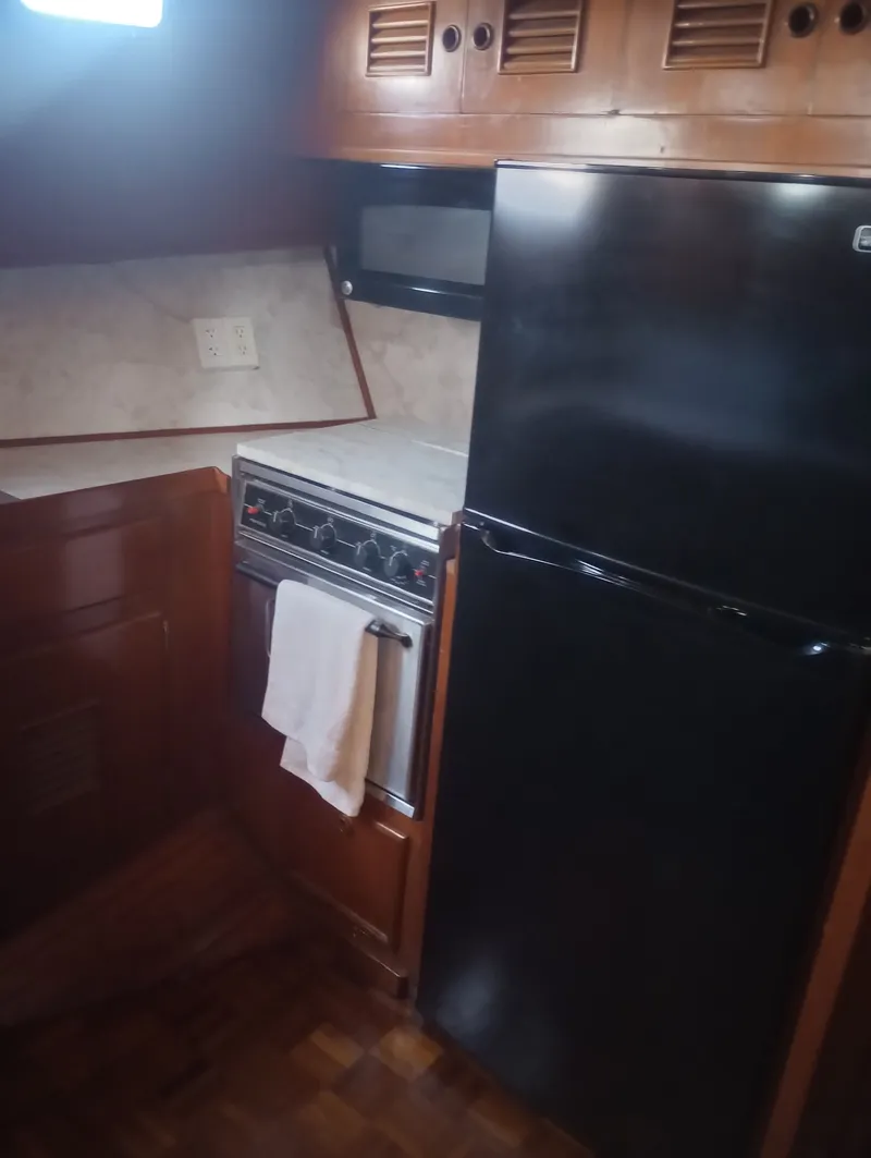 Slide: The Image of 1981 Marine Trading 44 Double Cabin yacht kitchen. - 30